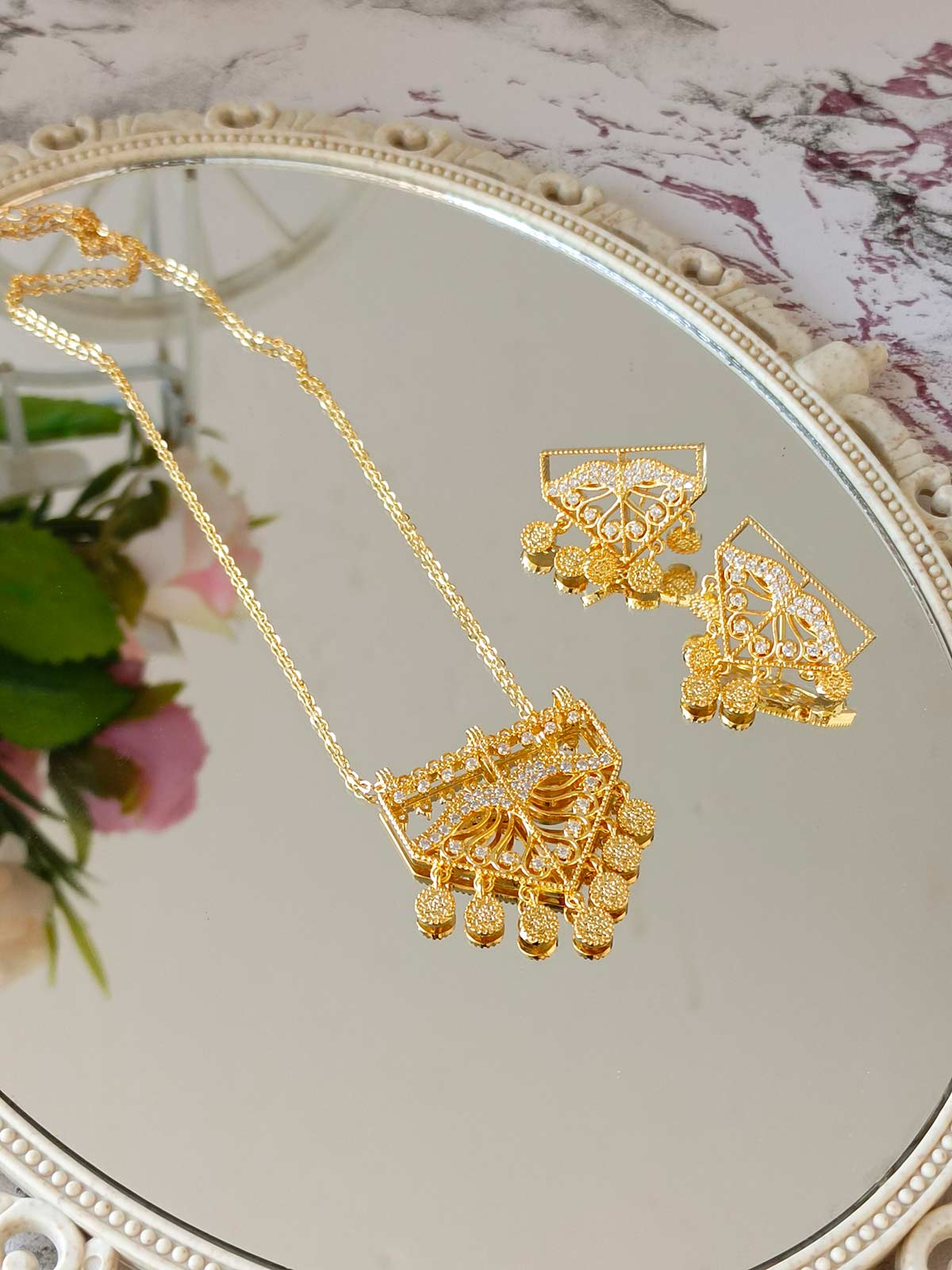 Stone studded necklace set with matching earrings