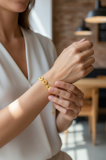 Gold Coin Charm Bracelet with Red & Green Stones
